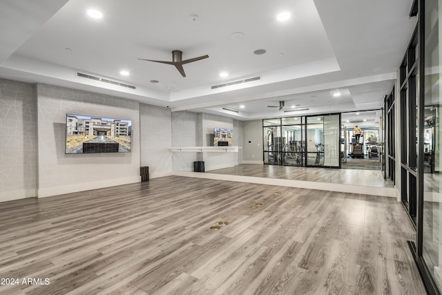 5250 E Deer Valley Dr Unit 140, Phoenix, AZ 85054 - workout room with a ceiling fan, a raised ceiling, wood finished floors, and recessed lighting