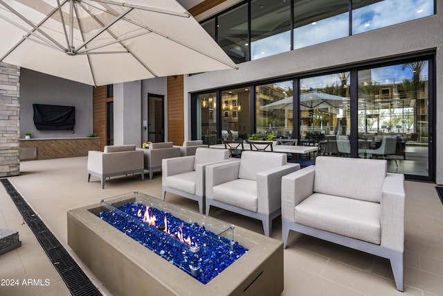 5250 E Deer Valley Dr Unit 140, Phoenix, AZ 85054 - view of patio featuring an outdoor living space with a fire pit