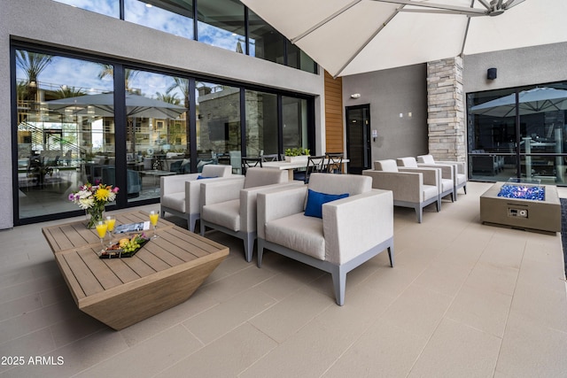 5250 E Deer Valley Dr Unit 140, Phoenix, AZ 85054 - view of patio featuring an outdoor living space with a fire pit