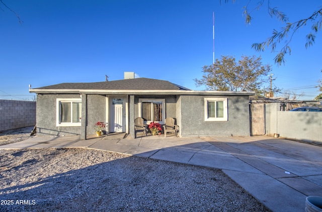 back of house with a patio area