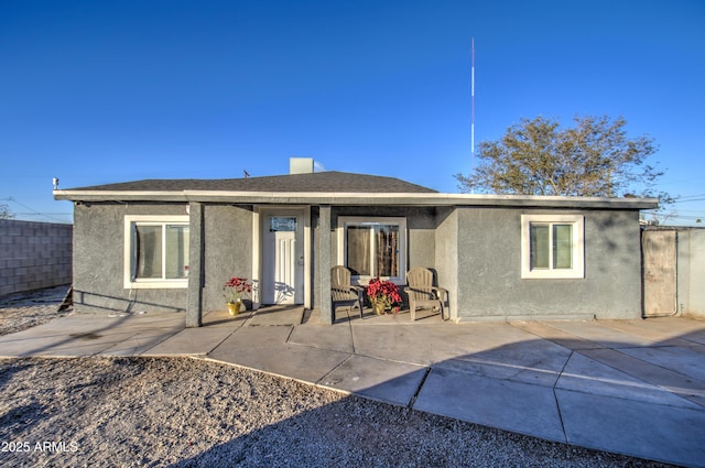 rear view of property with a patio area