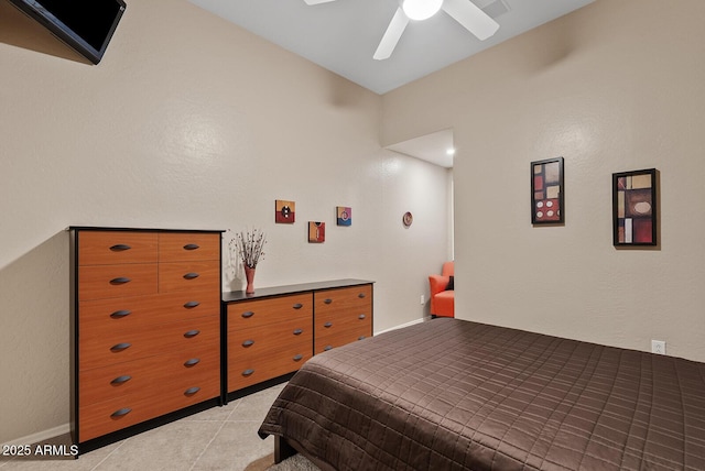 bedroom featuring ceiling fan and light tile patterned floors