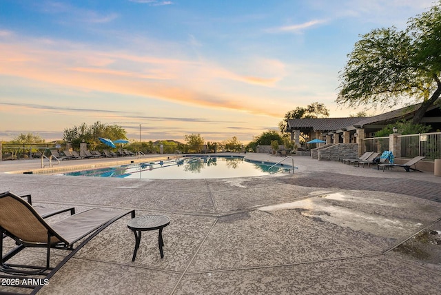 community pool with a patio area