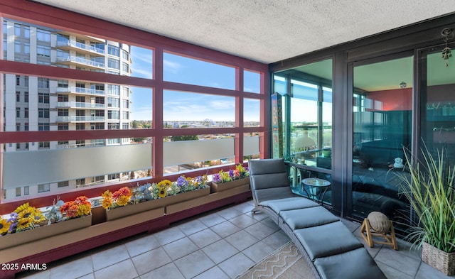 sunroom / solarium featuring a water view