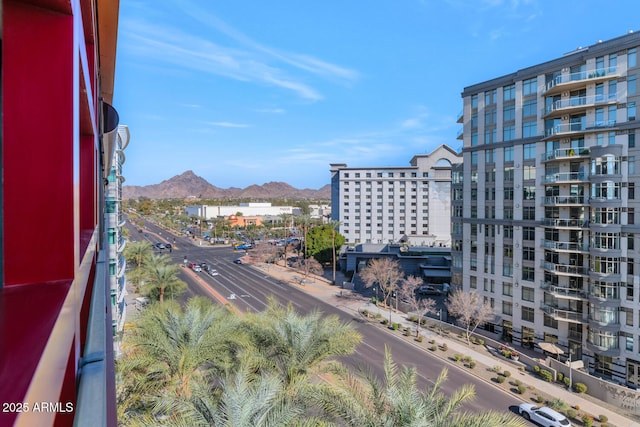 property's view of city featuring a mountain view