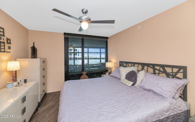 bedroom featuring ceiling fan and dark hardwood / wood-style floors