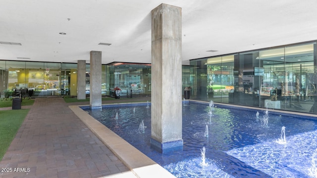 view of pool featuring pool water feature