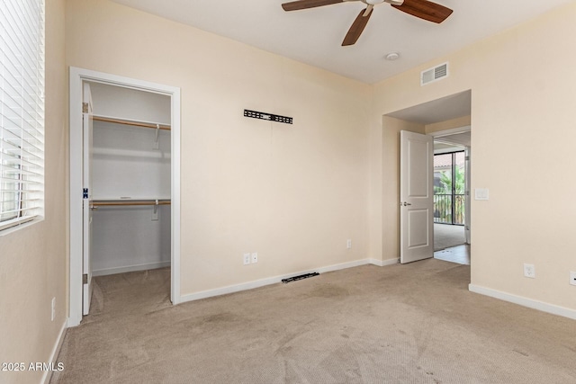 2315 N 52nd St Unit 144, Phoenix, AZ 85008 - unfurnished bedroom with carpet, a spacious closet, and baseboards