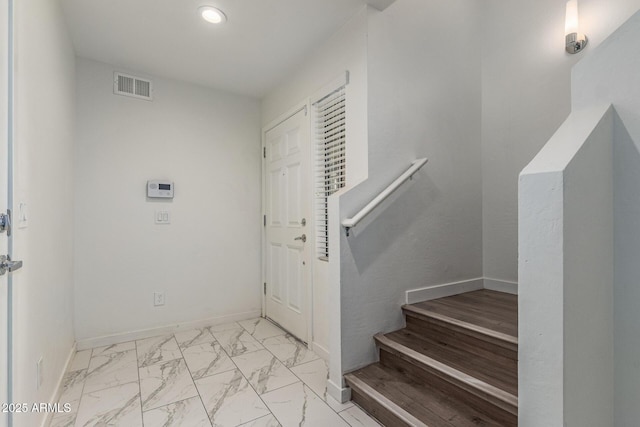 2315 N 52nd St Unit 144, Phoenix, AZ 85008 - entrance foyer with marble look tile flooring, recessed lighting, baseboards, and stairs