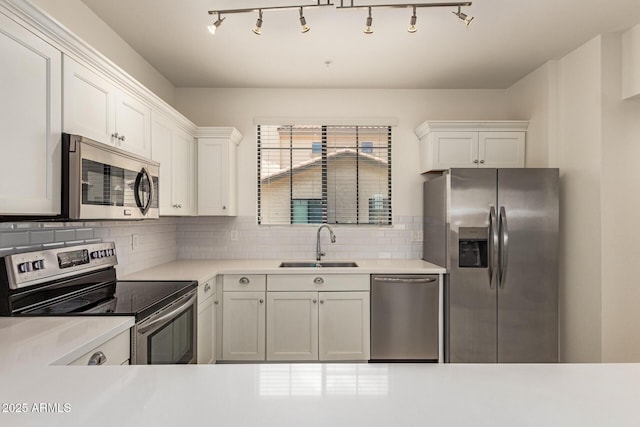 2315 N 52nd St Unit 144, Phoenix, AZ 85008 - kitchen with stainless steel appliances, a sink, light countertops, and white cabinets