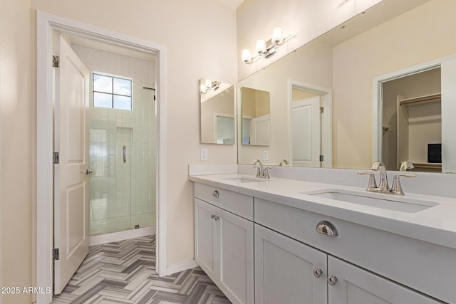 2315 N 52nd St Unit 144, Phoenix, AZ 85008 - bathroom with double vanity, a stall shower, and baseboards