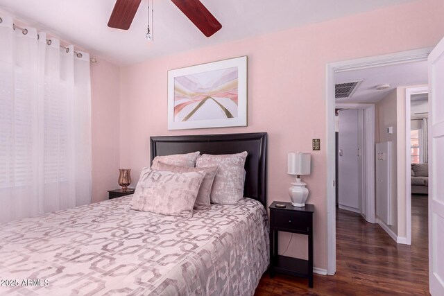 9603 N 1st Ave, Phoenix, AZ 85021 - bedroom with wood finished floors, baseboards, and a ceiling fan