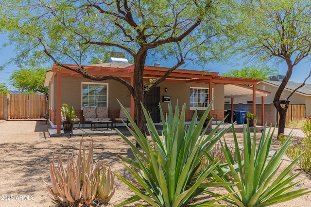 9603 N 1st Ave, Phoenix, AZ 85021 - view of front of house with a gate, an outdoor living space, and a patio area