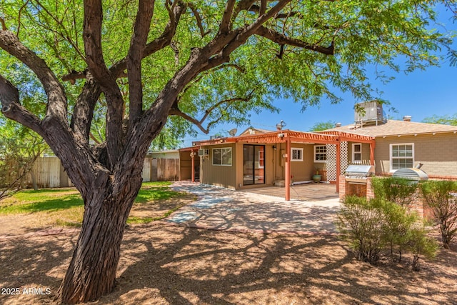 9603 N 1st Ave, Phoenix, AZ 85021 - back of house featuring a patio, exterior kitchen, and brick siding