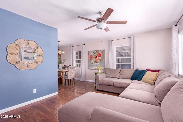 9603 N 1st Ave, Phoenix, AZ 85021 - living area featuring wood finished floors, ceiling fan, baseboards, and a chandelier