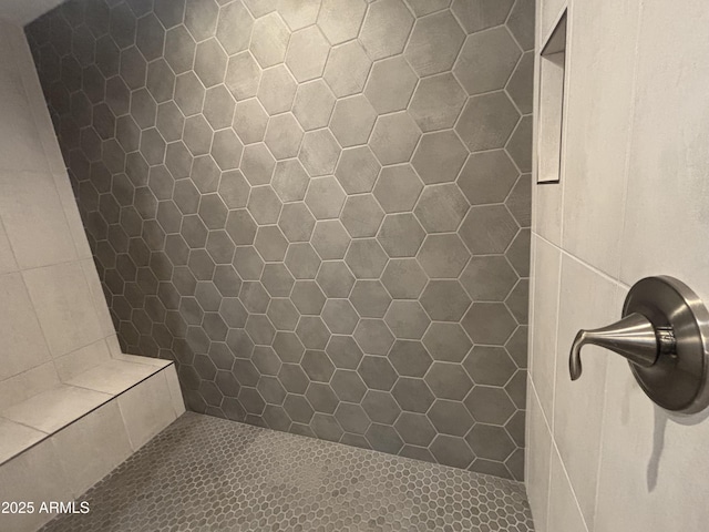 full bathroom with a tile shower