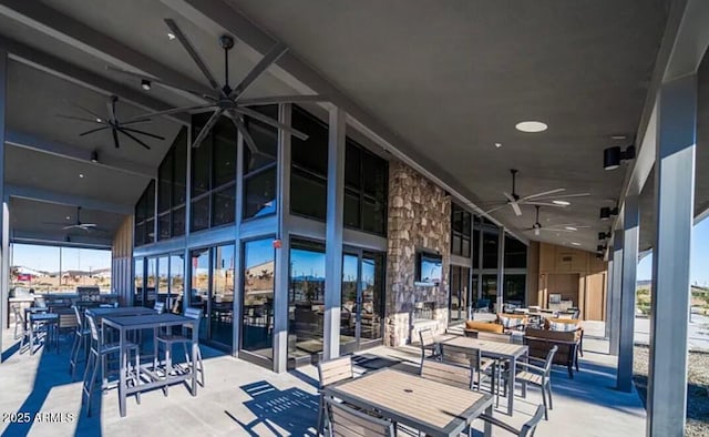 view of patio featuring a ceiling fan