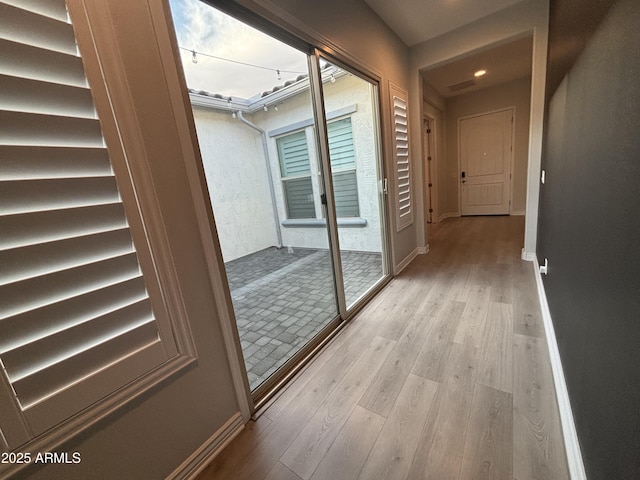 interior space featuring wood finished floors, visible vents, and baseboards