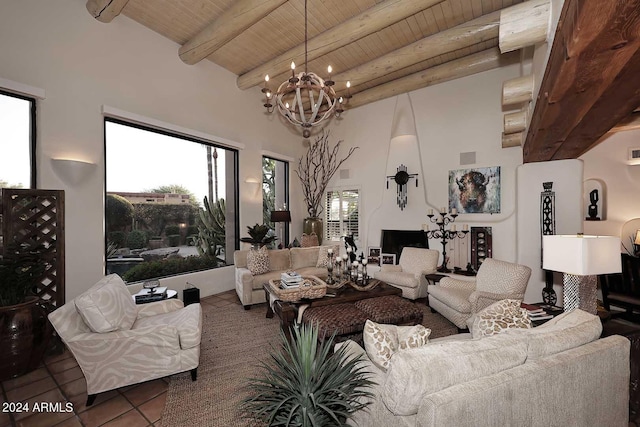 living room with a wealth of natural light, beam ceiling, wood ceiling, and tile patterned flooring