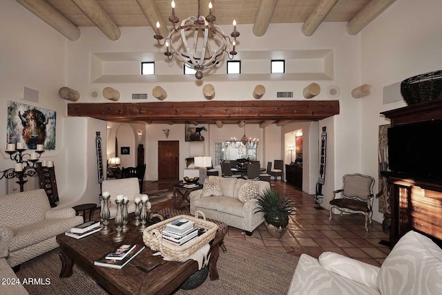 tiled living room with wood ceiling, a healthy amount of sunlight, and a high ceiling