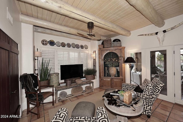 tiled living room with lofted ceiling with beams and wooden ceiling