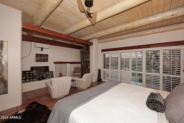 tiled bedroom featuring beam ceiling and wood ceiling