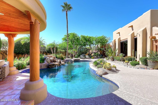 view of swimming pool featuring a patio area