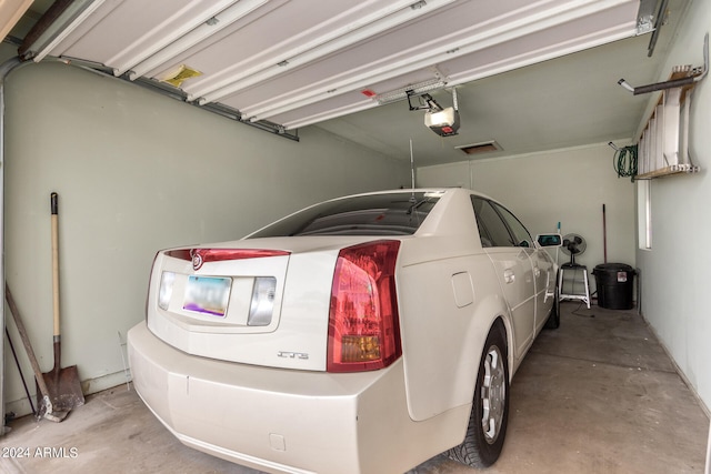 garage featuring a garage door opener