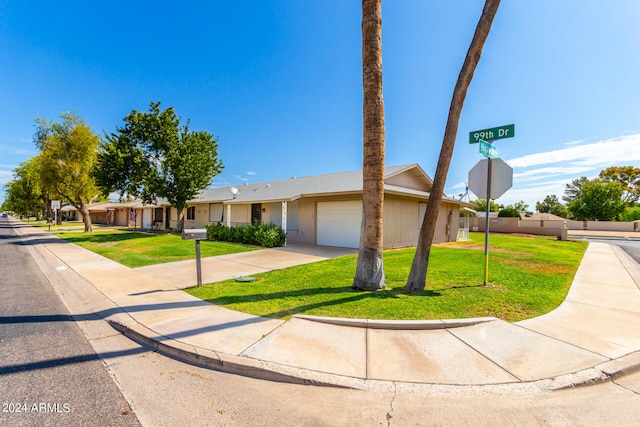 single story home with a front lawn and a garage