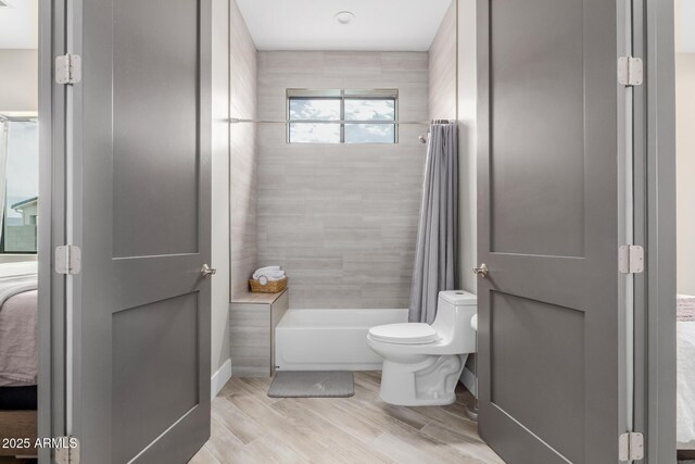 2516 W Joy Ranch Rd, Phoenix, AZ 85086 - bathroom with ensuite bathroom, shower / bath combo, toilet, and wood finished floors
