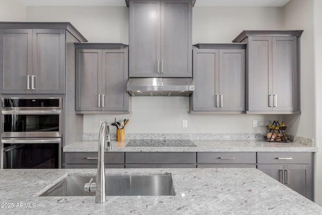 2516 W Joy Ranch Rd, Phoenix, AZ 85086 - kitchen featuring range hood, a sink, black electric stovetop, double oven, and light stone counters