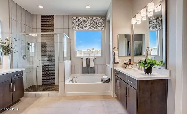 16336 W Jackson St, Goodyear, AZ 85338 - full bathroom with vanity, tile patterned floors, a bath, a shower stall, and recessed lighting