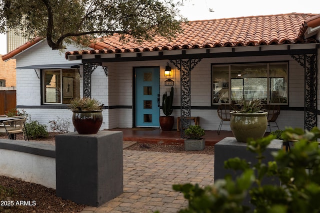 back of property with covered porch