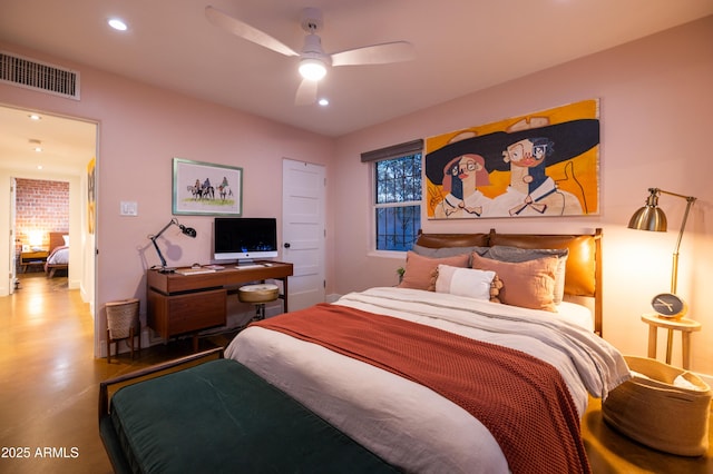 bedroom featuring ceiling fan and concrete floors