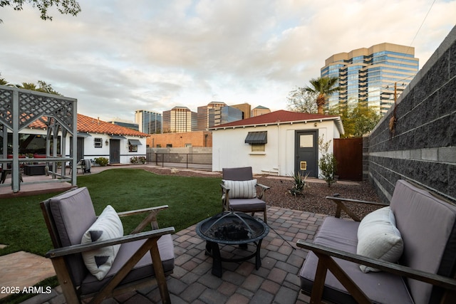 view of patio with an outdoor fire pit