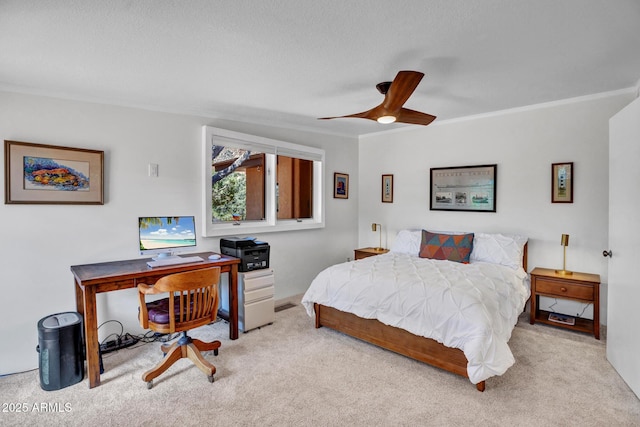 carpeted bedroom with a desk and a textured ceiling