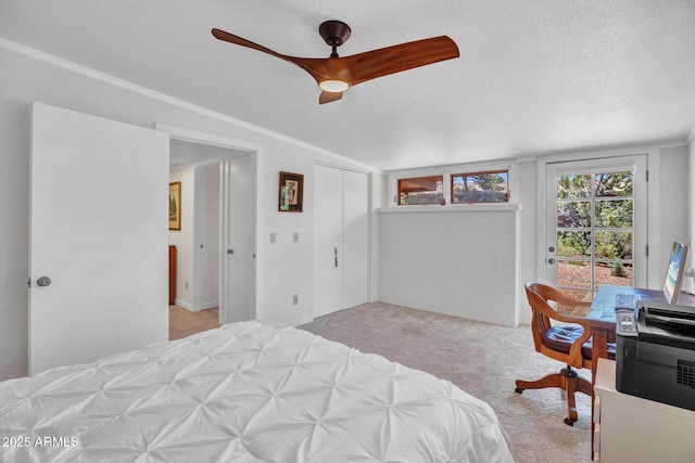 bedroom featuring access to exterior, carpet flooring, ceiling fan, crown molding, and a closet