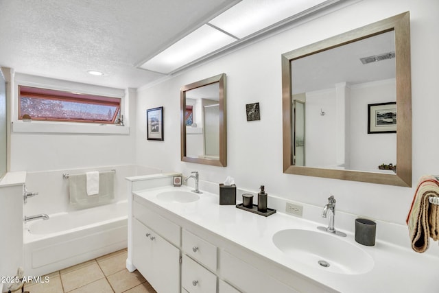 bathroom with a textured ceiling, tile patterned floors, a bath, double vanity, and a shower with door