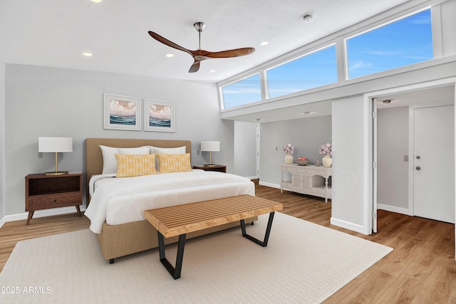 bedroom with wood finished floors, baseboards, recessed lighting, and a ceiling fan