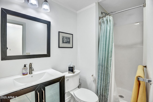 bathroom with a stall shower, ornamental molding, toilet, and vanity