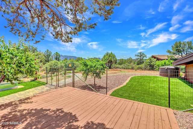 deck featuring a yard and a mountain view