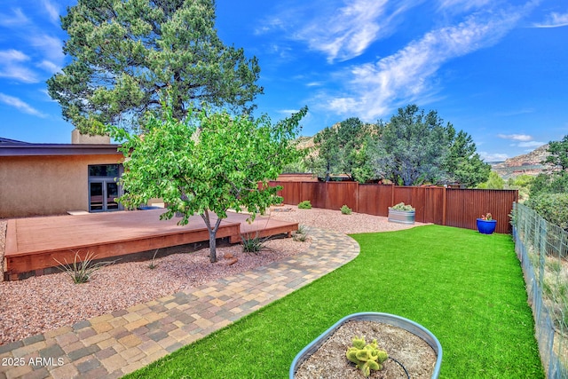 view of yard with a deck