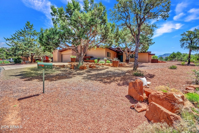 view of front of property with stucco siding and an attached garage