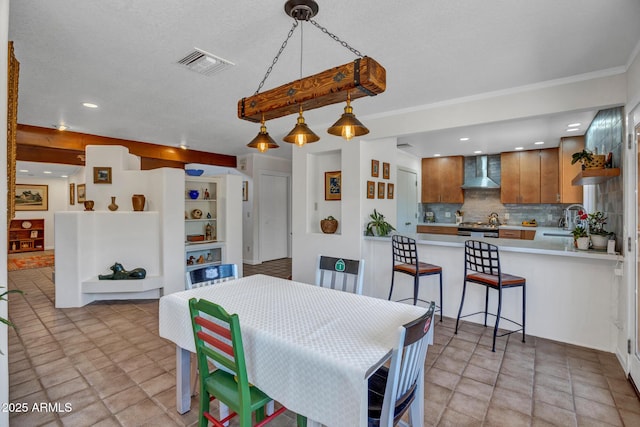 dining space with recessed lighting