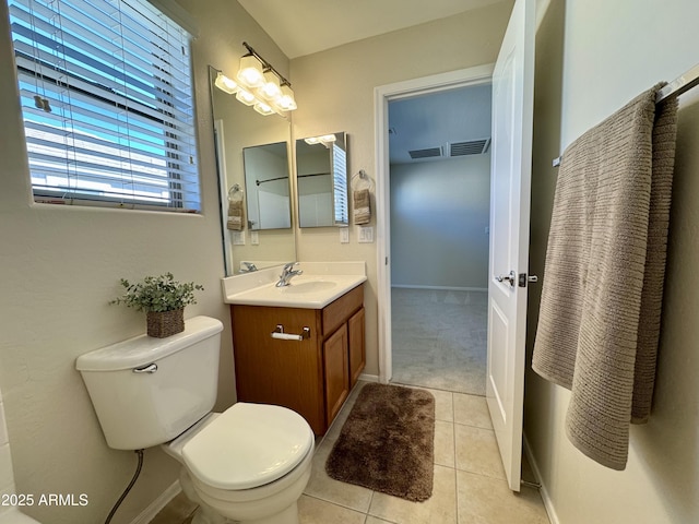 bathroom with visible vents, toilet, tile patterned flooring, and vanity