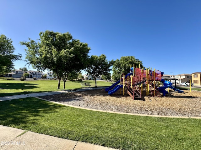 community play area featuring a lawn
