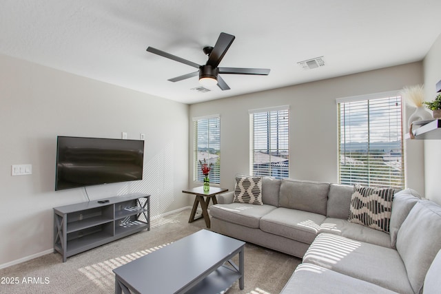 carpeted living room featuring ceiling fan