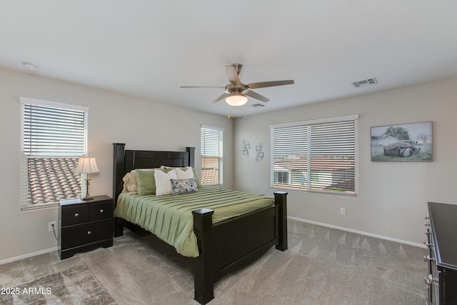 bedroom featuring ceiling fan and carpet