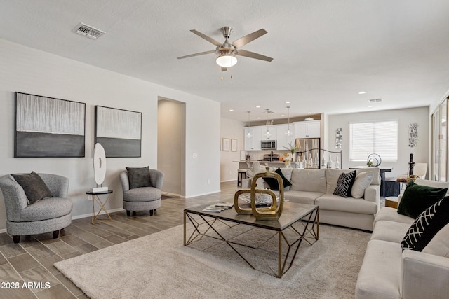 living room with ceiling fan