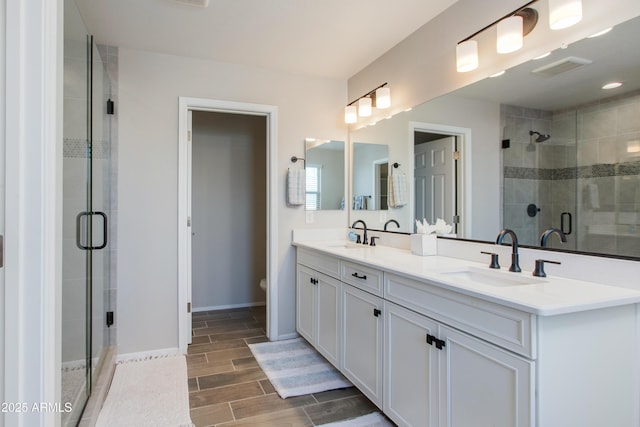 bathroom with vanity and an enclosed shower